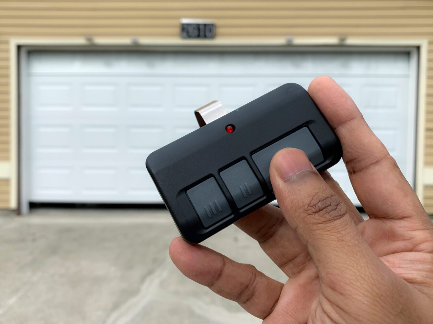 Using a garage door remote to open a garage door Using a garage door remote to open a garage door