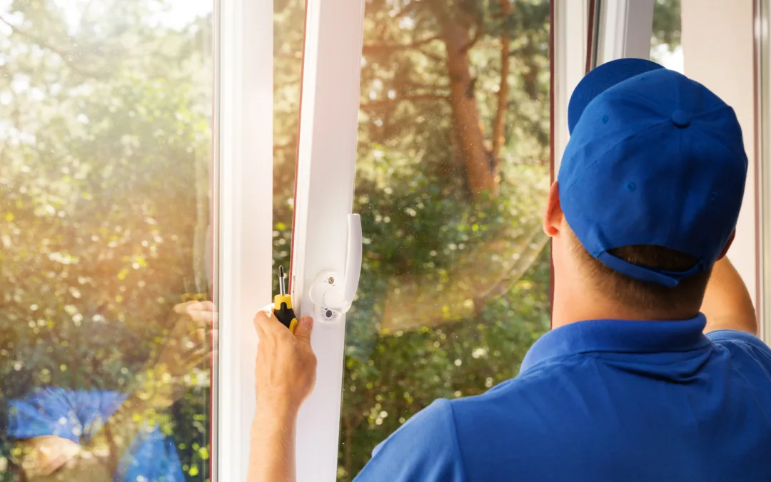 worker installing new plastic pvc window