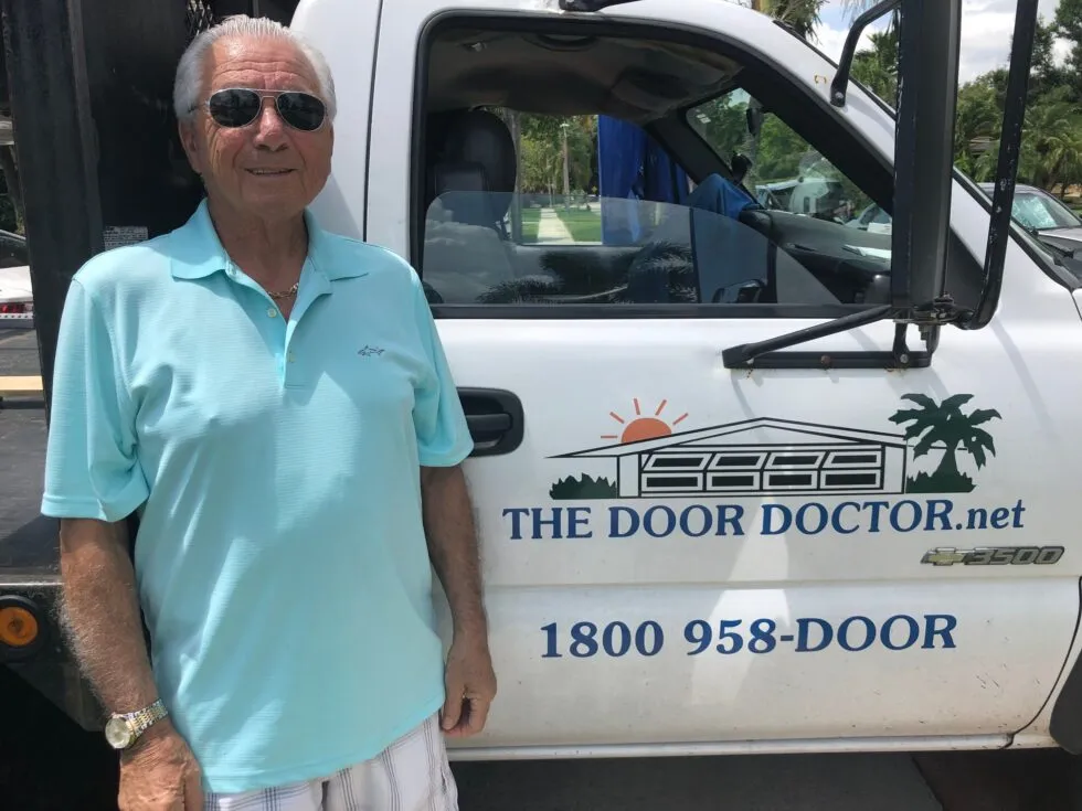 Sam-Randazzo-Door-Doc-Founder-1-980x735 owner of the door doctor, sam randazzo stands next to his company truck